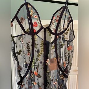 Kittenish boutique floral embroidered dress overlay.